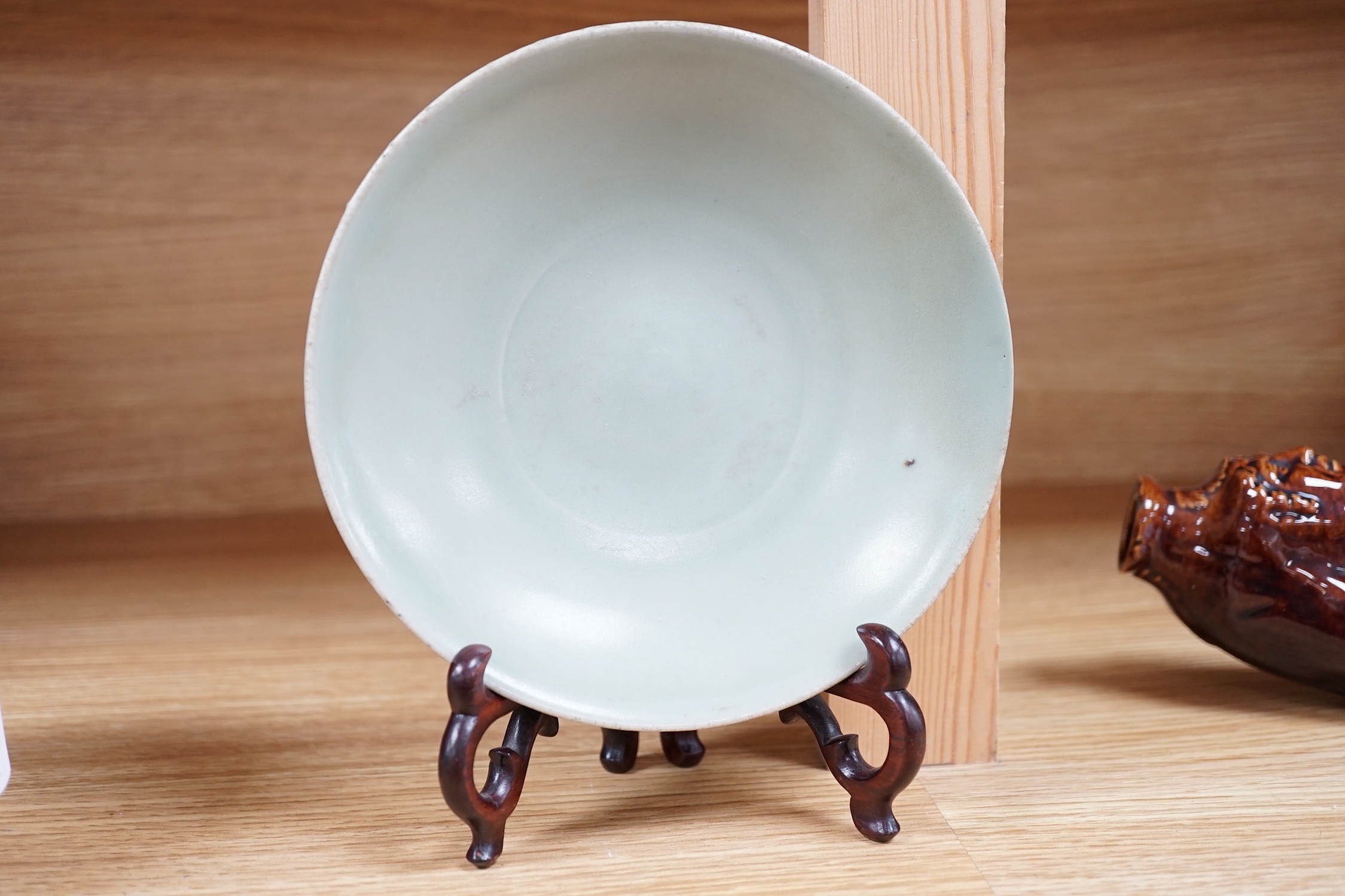 A Chinese Celadon dish and stand, 16cm diameter